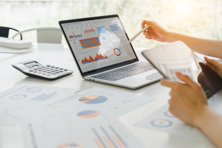 financial modeling laptop spreadsheet golden sunlight